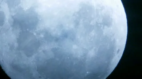 Extreme Close Up of Moon with Passing Clouds - HD Stock Footage 11138960
