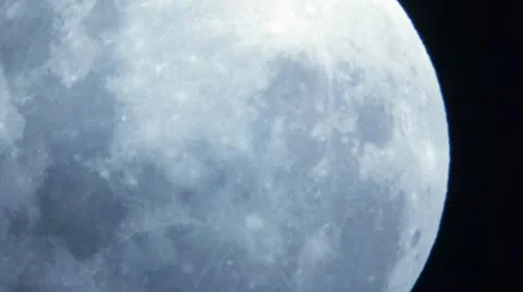 Extreme Close Up of Moon with Passing Clouds - HD Stock Footage 11139020