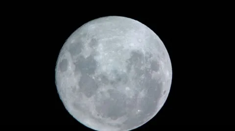 Extreme Close Up of Moon with Passing Clouds - HD Stock Footage 11145794