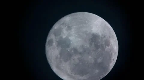 Extreme Close Up of Moon with Passing Clouds - HD Stock Footage 11145812