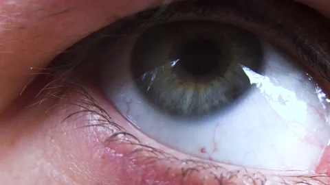Extreme close up of moving human eye iris 4K Stock Footage 133954627