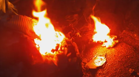 Extreme close up on open flame. Water douses it from the right. Slow motion. Stock Footage 63626460
