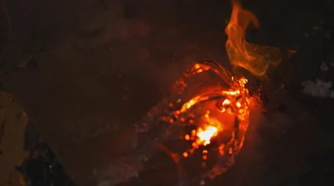 Extreme close up on open flame. Water douses it from the left. Slow motion. Stock Footage 63627127