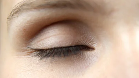 Extreme close up of opening beautiful blue woman eye and looking straight, hu Stock Footage 112397757