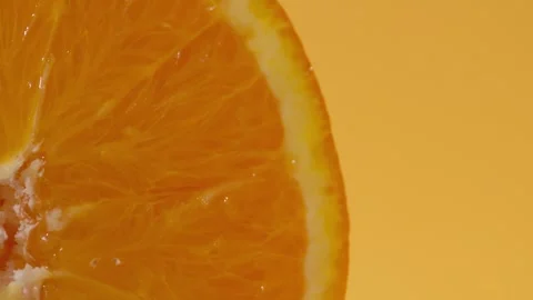 Extreme close-up of an orange slice, highlighting the juicy, vibrant flesh 스톡 동영상 274814647