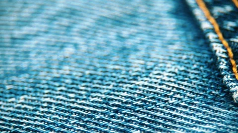 Extreme close-up pan shot of the dark blue pair of jeans' pocket stitched w.. Stock Footage 70567024