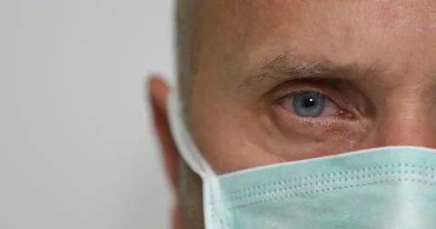 Extreme Close Up Pan View Presentation Surgeon Face with Blue Eyes Cover by Mask Stock-Footage 68416563