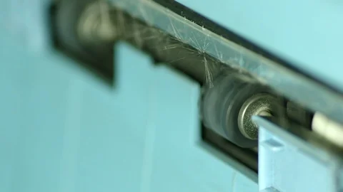 Extreme close up of papers exiting copy machine Stock Footage 97280627