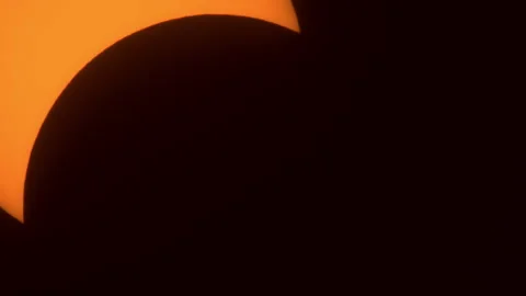 Extreme Close-up of Partial Solar Eclipse Passing Through Frame Stock Footage 272698418