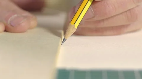 Extreme Close Up of Pencil Drawing Straight Line Along Ruler Stock Footage 339009232