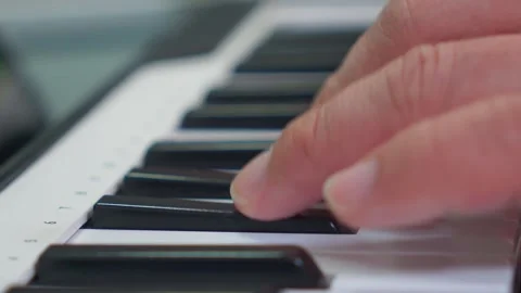 Extreme close up of pianist fingers practicing chords on electronic piano keyboa Video stock 338043683
