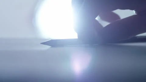 Extreme close-up of picking up and writing with pencil Stock Footage 171812901