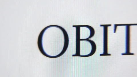 Extreme close-up of pixels on a computer screen making the word OBITUARIES. Stock Footage 75788269