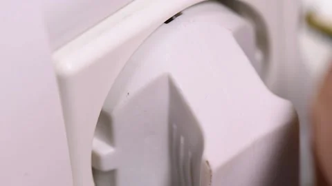 Extreme close-up of plugging and unplugging from the European power socket. 動画素材 140987662