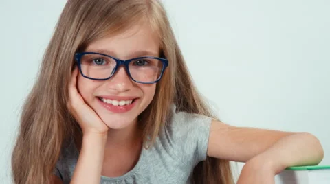 Extreme close up portrait cute student girl with long blond hair 7-8 years Stock Footage 65329596