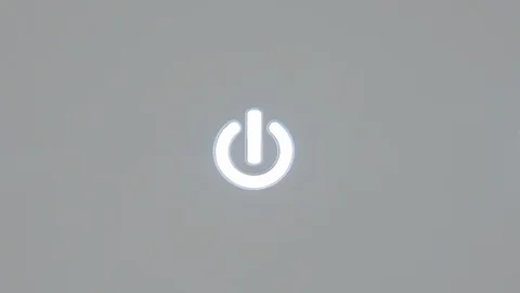 Extreme close-up of the power button icon turning off and on automatically Stock Footage 128839274
