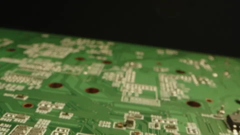 Extreme close up of a printed circuit board while the camera slowly moves out Video stock 315631436