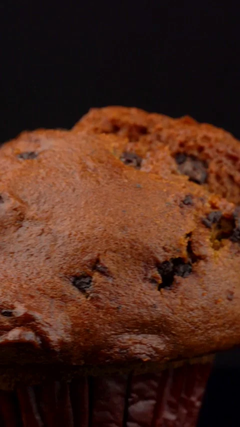 Extreme Close Up Pumpkin Chocolate Chip Muffin Rotating on Dark Background Stock Footage 330517428