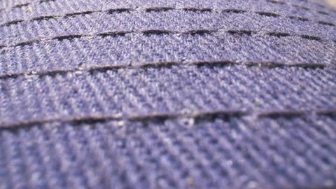 Extreme close up, rack focus on the stitching of a blue baseball cap. 스톡 동영상 134981937