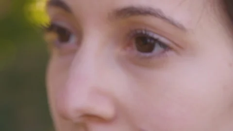 Extreme close up - rack focus of young woman's pretty eyes - Slow Motion - shot Stock Footage 125167533
