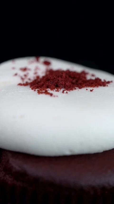 Extreme Close Up Red Velvet Cupcake with Cookie Crumbs Topping Stock Footage 330516779