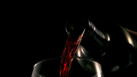 Extreme close up of red wine poured into glass. Slow motion 4k Stock Footage 89650939