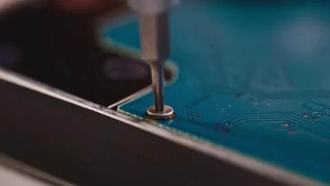 Extreme close-up of repair technician disassembling hard drive. Macro shot shows Stock Footage 315448227