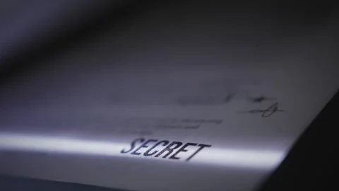 Extreme close up on report document labelled Top Secret being scanned or copied Video stock 313296738