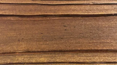 Extreme Close-Up of Rich Brown Horizontal Wood Grain Texture Vídeos de archivo 332749798