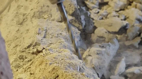 Extreme Close Up of Rotary Hammer Drill Bit Breaking Concrete with Dust Clou Stock Footage 342687466