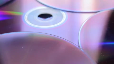 Extreme close of rotating compact discs. Electronic media of early computer age Video stock 194744472