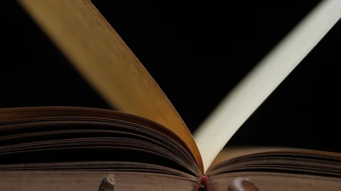 Extreme close-up of a rotating open book... | Stock Video | Pond5