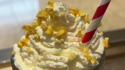 Extreme Close Up Rotating Shot Of Mango Smoothie Top Stock Footage 332662401