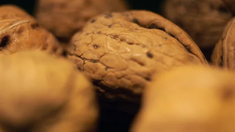 Extreme Close Up of Rotating Walnuts in 50p Stock Footage 336689651