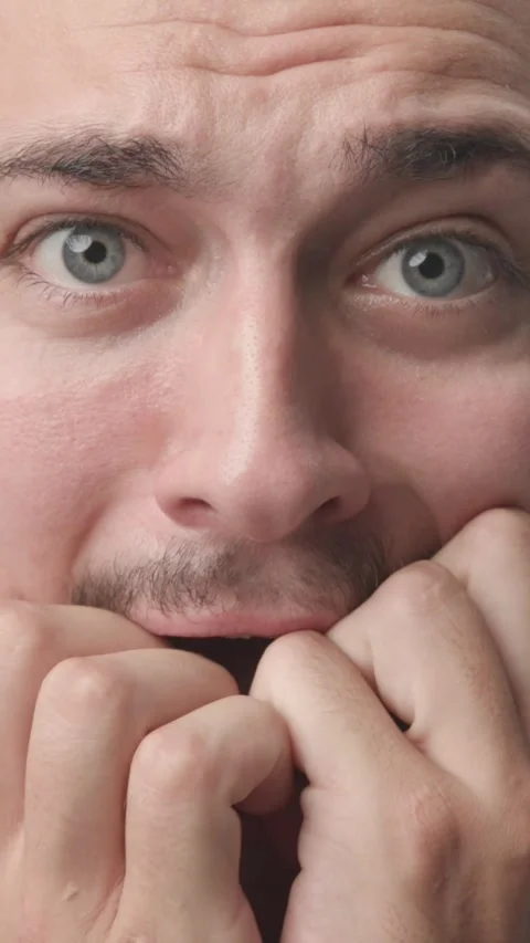 Extreme Close-up of Scared and Anxious Young Man Looking at Camera Stock Footage 341659516