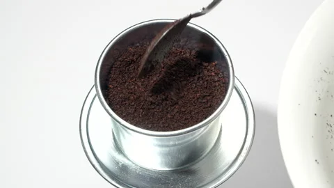 Extreme Close Up Scooping Ground Coffee Vietnamese Phin Filter Video stock 331927660