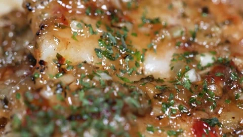 Extreme Close-up of Seared Garlic Butter Cod Strips with Sweet Chili Lime Glaze 動画素材 337440886