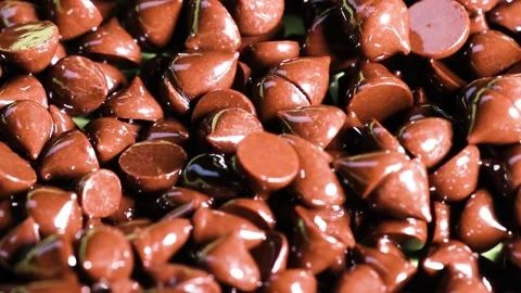 Extreme Close Up of Shiny Brown Chocolate Chips in a Pile Stock Footage 327346715