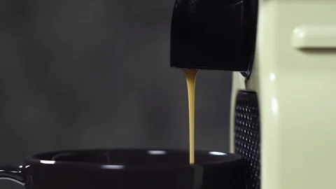 Extreme close-up shooting of a coffee machine pouring into glass cup Stock Footage 111346727