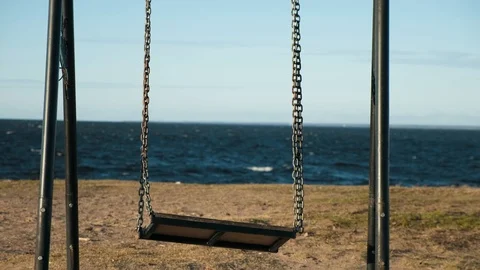 Extreme close up shot of empty seesaw swing by the sea Stock Footage 126934419