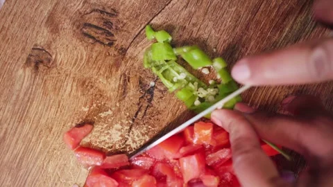 Extreme close up shot of green chilli cutting on a wooden board. Stock Footage 282766523