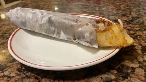Extreme close up shot of a iconic Bengali style snack called a "Katti Stock Footage 204565719