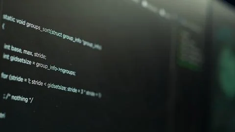 Extreme close up shot of lines of code displayed on computer monitors 写真素材