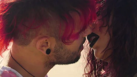 Extreme close up shot of a Punk guy and Goth girl who are about to kiss Video stock 293114717
