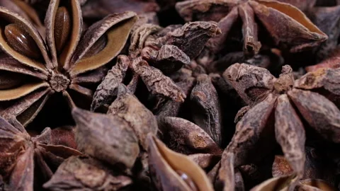 Extreme close-up shot (slider plus rotation) over a pile of star anise Stock Footage 142122203