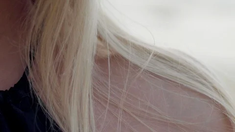 Extreme Close up of shoulder of Beautiful blonde woman posing at the beach, with Stock Footage 107828397