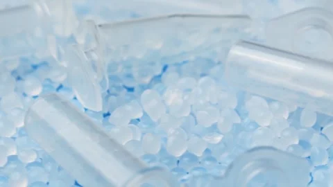 Extreme close up shows microtubes and polymer granules rotating for medical Stock Footage 347049760