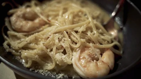 Extreme close up Shrimp Scampi fork in bowl Manhattan NYC 4k Stock Footage 255755576