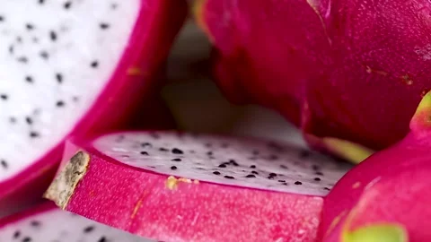 Extreme Close Up of Sliced White Dragon Fruit with Black Seeds Stock Footage 326080964