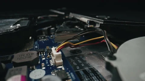 Extreme close-up sliding view of a laptop computer chip, shot with laowa probe Stock Footage 229802604